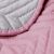 Close-up of AmeliaHome SOFTA pink and gray bedspread fabric texture
