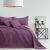 AmeliaHome SOFTA purple quilted bedspread on a bed