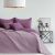 AmeliaHome SOFTA purple quilted bedspread on a made bed