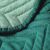 Close-up of AmeliaHome SOFTA green bedspread fabric texture