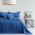 AmeliaHome SOFTA dark blue bedspread on bed with pillows in bedroom setting