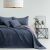 AmeliaHome SOFTA graphite grey and light purple reversible bedspread on a bed