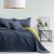 AmeliaHome SOFTA graphite grey and mustard yellow bedspread on a made bed