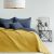 AmeliaHome SOFTA graphite grey and mustard yellow bedspread on a bed with pillows