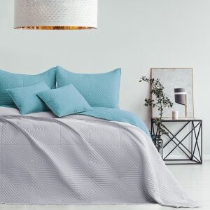 AmeliaHome SOFTA light blue bedspread on a bed in a stylish bedroom setting. - Interior design