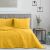AmeliaHome PALSHA yellow velvet bedspread on a bed in a modern bedroom