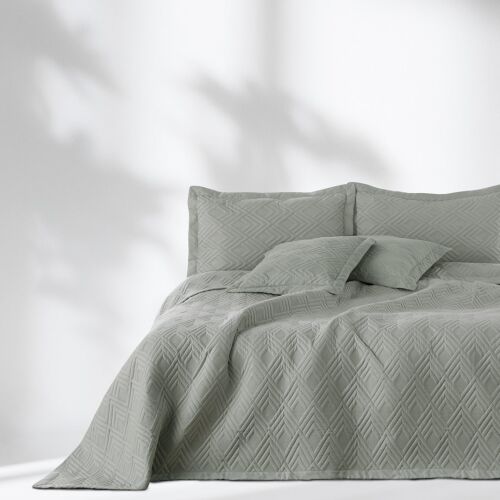 Grey AmeliaHome Ophelia bedspread with geometric pattern on a bed.