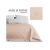 AmeliaHome Ophelia powder pink bedspread on a bed with logo and corner detail