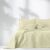 AmeliaHome Ophelia beige bedspread on a bed in a bright room