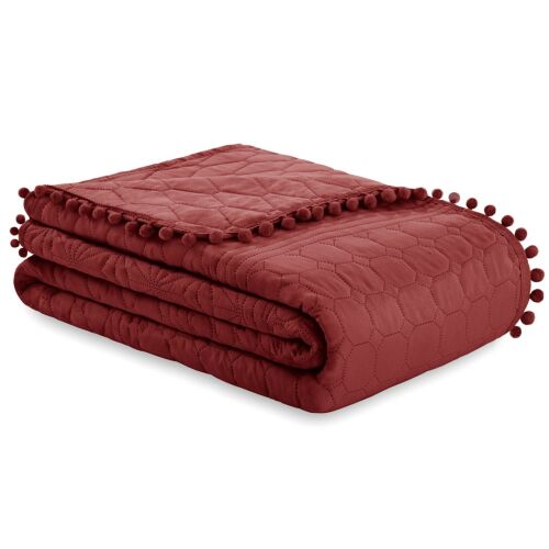 Folded AmeliaHome Meadore rose microfiber bedspread with pom poms.