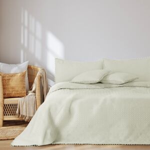 AmeliaHome Meadore cream bedspread with pom poms on a bed in a bedroom setting - Interior design