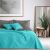 DecoKing AXEL turquoise and gray bedspread on bed with pillows in bedroom