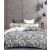 Set lenjerie de pat reversibil DecoKing Hypnosis gri floral pe pat