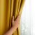 Close-up of AmeliaHome mustard yellow blackout curtain texture and light blocking