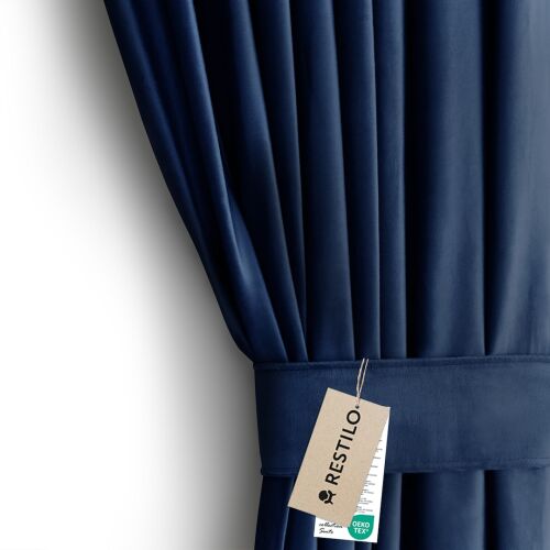 Close-up of AmeliaHome indigo blue velvet curtain with tieback