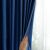 Showing the texture and light blocking of AmeliaHome Indigo Blue Velvet Curtain