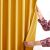 Showing the back of AmeliaHome mustard yellow velvet curtain