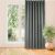 VILA graphite grey blackout curtain hanging in front of a window.