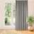 VILA grey blackout curtain hanging in front of a window
