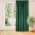 VILA glass green blackout curtain hanging in front of a window.