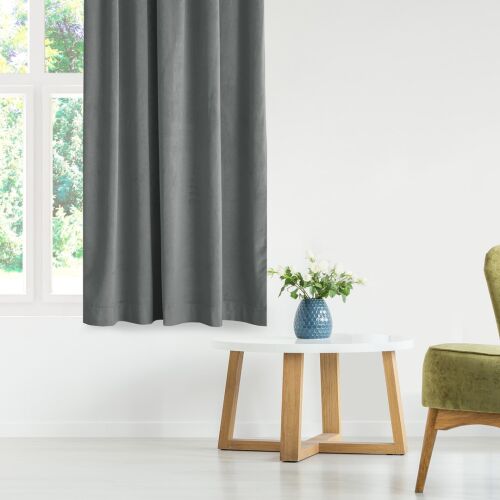 Vila graphite grey blackout curtain hanging in a living room setting.