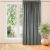 Vila graphite grey blackout curtain hanging in front of a window.
