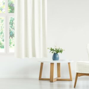MILANA cream blackout curtain hanging in a living room setting - Decoration