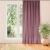 Milana light purple blackout curtain hanging in front of a window