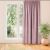 Milana pink blackout curtain hanging in front of a window