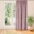 MILANA pink blackout curtain hanging in front of a window