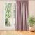 MILANA pink blackout curtain hanging in front of a window