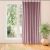 MILANA pink blackout curtain hanging in front of a window