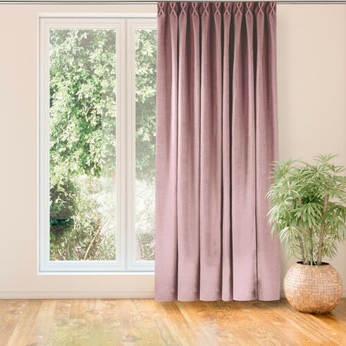 Milana pink blackout curtain hanging in front of a window