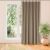 VILA beige blackout curtain hanging in a room