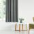 VILA graphite grey blackout curtain in a living room setting with table and chair
