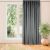 VILA graphite grey blackout curtain hanging in front of a window