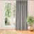 VILA grey blackout curtain hanging in a living room setting