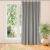 VILA grey blackout curtain hanging in front of a window