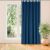 VILA indigo blackout curtain hanging in front of a window.