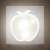 Apple shaped LED night light, warm white, plugged into a wall socket