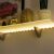 Warm white LED strip lighting under shelf