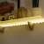 LED strip light, warm white, 1 meter, battery powered, 3 AA batteries, shelf lighting example