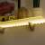 LED strip light, warm white, 1 meter, battery powered, 3 AA batteries, shelf lighting example
