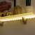 LED strip light, warm white, 1 meter, battery powered, 3 AA batteries, shelf lighting example