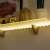 LED strip light, warm white, 1 meter, battery powered, 3 AA batteries, shelf lighting example