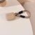 Tech-Protect világosbarna AirPods Pro 1/2 tok kötéllel az asztalon