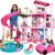 Mattel Barbie Traumhaus mit Puppen, die in verschiedenen Bereichen spielen