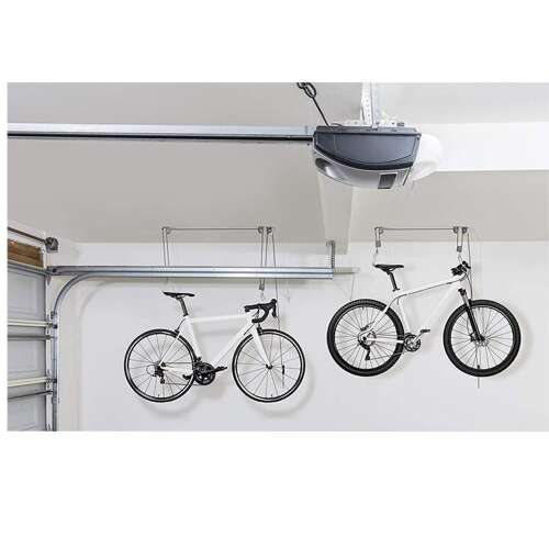 Black ceiling bike storage system with two bikes hanging from it