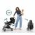 Woman folding Nukido Paseo stroller with one hand while holding baby, easy folding