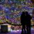 People admiring Christmas tree decorated with Springos Cl0542 LED lights